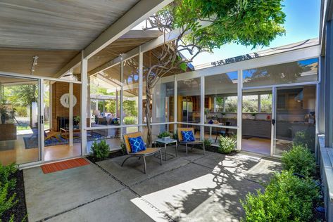 Photo 2 of 12 in A Bay Area Eichler With Custom Updates Hits the Market at $1.29M - Dwell Eichler Homes Atrium, Outdoor Concrete Patio, Eichler Atrium, Central Atrium, Atrium Design, Mid Century Exterior, Eichler Homes, Porch Deck, Concrete Patio