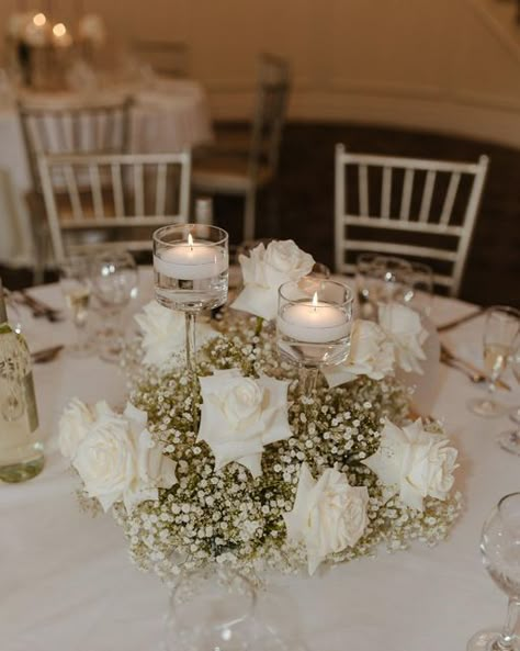 Flawless Functions on Instagram: "Candles + Baby’s Breath + White roses is currently the most trending wedding flower combination. It is classic and timeless. Loved creating this look for @rachelrizzo 🤍 #wedding #weddingday #weddingvenue #weddingcenterpiece #candlecenterpiece #babysbreathwedding #whiterosewedding #weddingtablesetting #weddingtrends #weddinginspo #bride #bridal #ctbride #ctwedding #bridalshower" Wedding Centrepiece Flowers Candles, Best Wedding Centerpieces, Wedding Table Decorations Roses, Diy White Floral Arrangements, Babysbreath Centerpieces With Candles, Classic White Wedding Florals, White Roses Baby Breath Wedding, White Rose And Candle Centerpiece, White Roses And Baby Breath Centerpieces