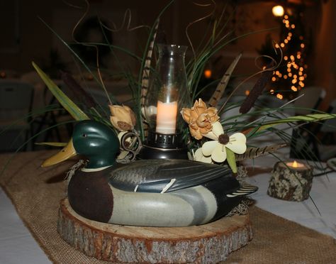 Decoy and lantern centerpiece - needs help, but could be a possibility. Camo Wedding Centerpieces, Hunting Themed Wedding, Duck Hunting Wedding, Wedding Buffet Table Decor, Hunting Wedding Theme, Grooms Cake Tables, Wild Game Dinner, Rehearsal Dinner Themes, Grooms Table