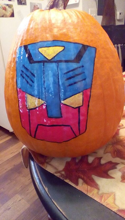 Transformers Autobot Pumpkin Transformer Pumpkin Painting, Transformer Pumpkin, Transformers Pumpkin, Optimus Prime Painting, Transformers Painting, Badass Halloween Costumes, Pumpkin Carving Templates, Pumpkin Ideas, Pumpkin Painting