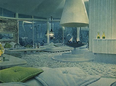 Alexander Presley Home Interior 1962  Best known as Elvis and Priscilla Presley's honeymoon retreat, and also known as the "House of Tomorrow," this Palm Springs home was orginally a custom-built residence for Bob and Helene Alexander. Architects - Palmer & Krisel. 1962. The image above was taken from a September 1962 piece in Life Magazine that profiled the futuristic home and the Alexander family.  Just wonder how they vacuumed that fluffy carpet back then.. The House Of Tomorrow, Honeymoon House, House Of Tomorrow, Retro Rooms, Palm Springs Home, Retro Interior Design, Futuristic Home, Retro Renovation, Elvis And Priscilla