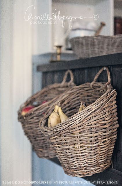 Store your fruit and veggies in a basket on the side of your cabinets. Basket On Wall, Basket Hanging, Basket Case, Wicker Basket, Kitchen Redo, Fruit Basket, Kitchen Pantry, Hanging Baskets, Rustic Kitchen