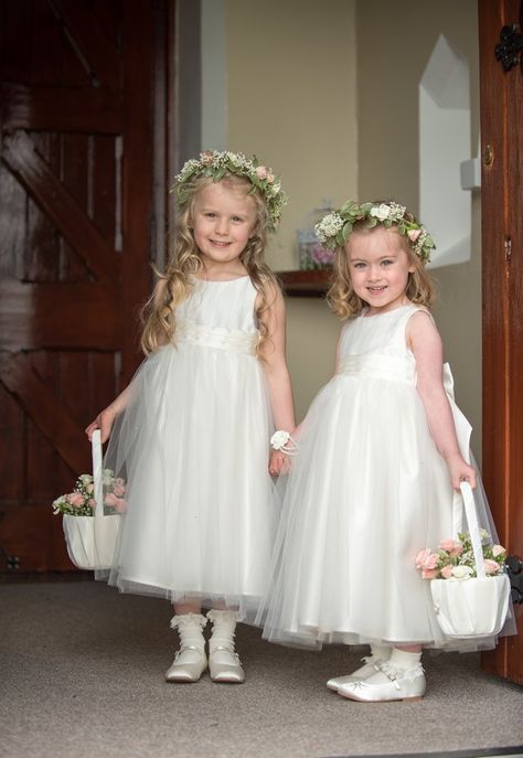 Adorable flower girls in white Paul Costelloe dresses with flower baskets and headresses Flowergirls Dress White, Flowergirls Wedding Dresses, Flowergirls Dress, Flower Girl Dresses White, Engagement Looks, Paul Costelloe, Ring Bearer Flower Girl, Corsage And Boutonniere Set, Village Wedding