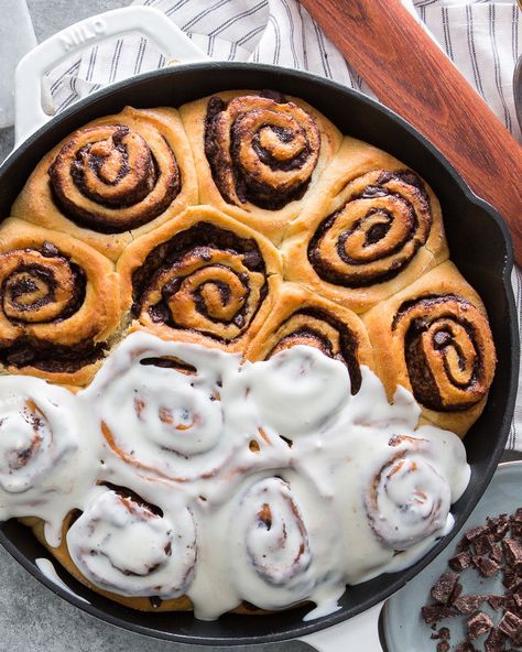 You won’t ever go back to classic cinnamon rolls again. We filled these golden rolls with chocolate, but not just any chocolate—Mexican cinnamon chocolate. Stone-ground, Mexican-style dark chocolate is filled with warm cinnamon spice and has a subtle grittiness that gives these cinnamon rolls even more explosive flavor and complex texture. Once you smother the rolls in the luscious Cream Cheese Glaze, serve them straight from the skillet to keep them warm and gooey. Cinnamon Rolls With Chocolate, Chocolate Cinnamon Rolls, Taza Chocolate, Cinnamon Roll Bake, Mexican Chocolate, Cream Cheese Glaze, Stone Ground, Cinnamon Rolls Recipe, Cinnamon Spice