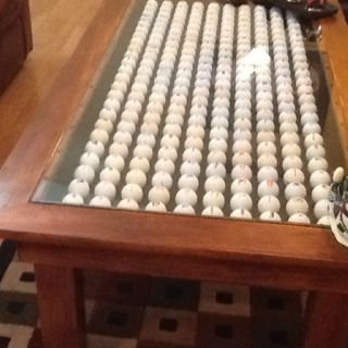 Logo golf ball coffee table my son made for me. Fw Logo, Ball Coffee Table, Golf Display, Golf Club Crafts, Golf Furniture, Golf Crafts, Old Wooden Chairs, Golf Ball Displays, Cabin Room