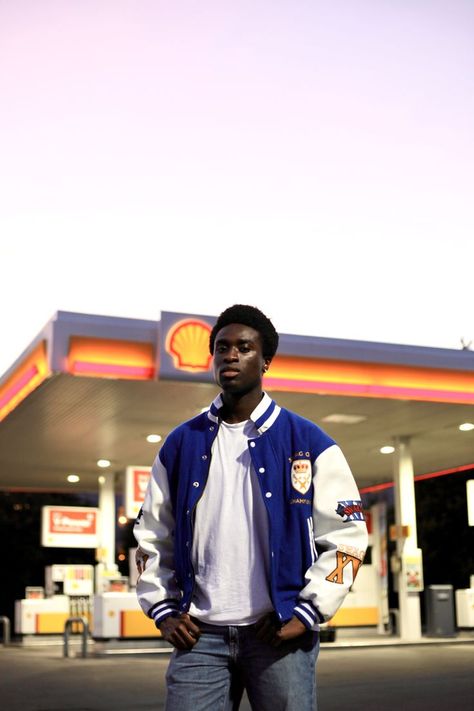 Black Man in vintage royal blue varsity jacket at a gas station photoshoot Convient Store Photoshoot, Gas Station Photoshoot Instagram, Jacket And Baggy Jeans, Navy Blue Varsity Jacket, Gas Station Photoshoot, Blue Varsity Jacket, Mini Photoshoot, Denim Photoshoot, Streetwear Photoshoot