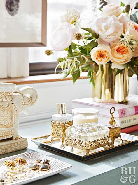 A shallow tray is the perfect place to display perfume and lotion bottles for easy access. Bedroom Inspirations Dresser Decor, Styling A Dresser Top Master Bedrooms Glam, Diy Dresser Decor, Dresser Vignette Bedroom, Decorating Bedroom Dresser, Dresser Top Ideas Bedroom, How To Style Dresser Top, Simple Dresser Decor Bedroom, Decorating Dresser Tops Bedroom