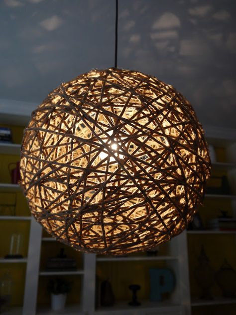 I'm going to do this.  You can also use white twine. I will use one of the large round punching balloons from the dollar store as it will be easier to pop and get out. Twine Balls, Sphere Lamp, School House Lighting, Diy Pendant Light, String Ball Lights, Diy Light Fixtures, Wrapped Lights, Bear Sculptures, Bulb String Lights