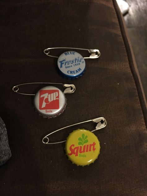 Homemade bottle cap pins for Disney’s Up costume Diy Pins From Bottle Caps, How To Make Pins With Bottle Caps, How To Make Bottle Cap Pins, How To Make Diy Pins With Bottle Caps, How To Make A Pin Out Of A Bottle Cap, Bottle Cap Pins Diy Punk, Bottle Cap Pins, Homemade Pins, Jacket Art