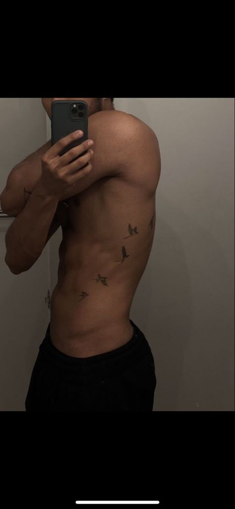 Bird tattoo Bird Side Tattoo Men, Small Tattoos For Men Birds, Mens Birds Tattoo, Tattoo Designs Men Aesthetic, Birds On Ribs Tattoo Men, Men Ribs Tattoo Ideas, Bird Tattoo On Stomach, Birds On Side Tattoo Men, Birds Going Up Arm Tattoo