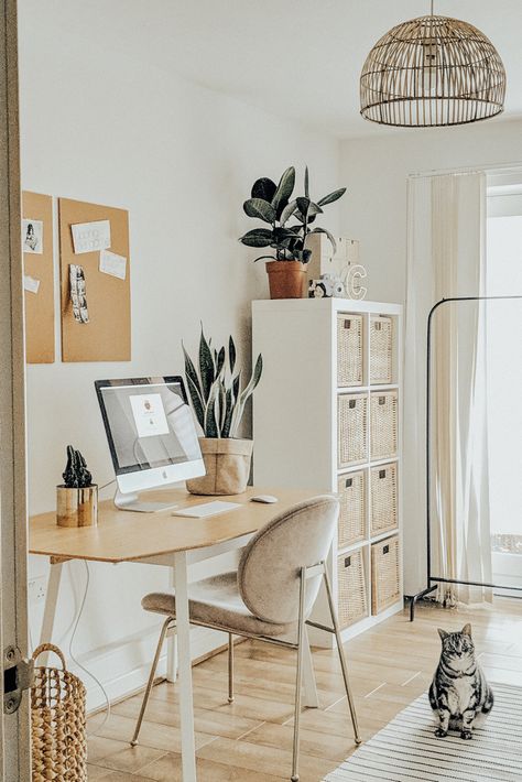 Welcome to my home office. I wanted a space to feel open and fresh but warm and welcoming. The white furniture (ikea dining table come desk) and the pink west Elm chair made the space feel minimal and bright. Using rattan features such as the Kallax rattan storage boxes and the BHS lamp shade And the cork board added the Boho vibe I was looking for and made the space feel cosy and fresh at the same time. Light And Airy Office, Airy Office, One Bedroom Flat, Interior Design Plan, Dekorasi Kamar Tidur, Small Home Office, Home Office Setup, Home Office Space, Office Interior Design