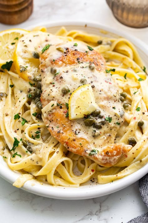 Creamy lemon chicken piccata is a delicious 30-minute meal with lightly breaded chicken breasts smothered in a garlic and caper cream sauce. Lemon Caper Artichoke Chicken Piccata, Creamy Lemon Caper Chicken, Lemon Butter Caper Chicken, Lemon Chicken Piccata Recipe With Capers, Chicken Piccata Recipe With Pasta, Lemon Caper Sauce Pasta, Chicken Lemon Capers Recipe, Chicken Piccata With Angel Hair Pasta, Chicken Piccata Easy Healthy