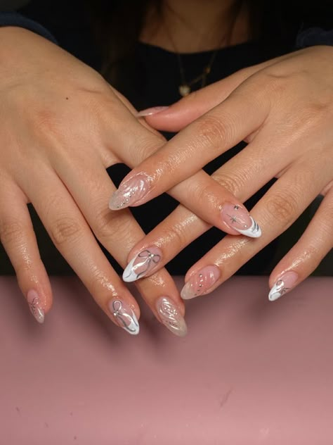 Nail art, chrome, bows, french tips Chrome French Tip With Design, Chrome Nails With French Tips, Chrome French Tip With Pearls, Chrome Bow Nails, Silver Bow Nails, French Tip Pearl Chrome, French Tip Nails With Bow Charm, Silver Chrome French Tip Nails With Charms, French Tip Chrome