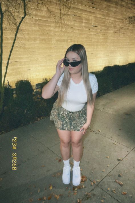 White shirt, camo skirt, Nike Nocta x Drake af1, Blonde hair, Black glasses Drake Af1, White Body Suit Outfit, Air Forces Black, Body Suit Outfit, Old School Outfits, X Drake, Camo Skirt, Bad Girl Wallpaper, Black Glasses