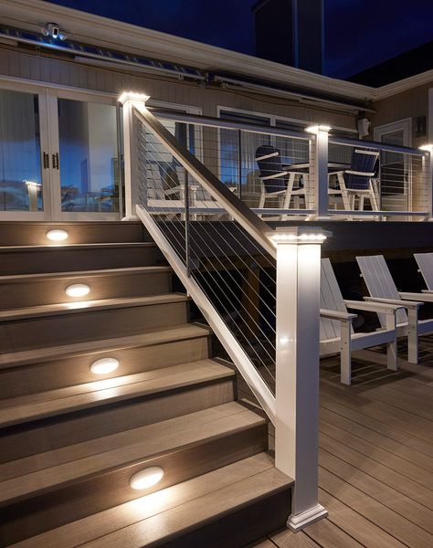 Add a soft, subtle glow to your deck with lighted island caps. Perfect for creating evening ambience. Easy on the Eyes Lights shine downward for a delicate radiance. A Subtle Glow Creates a slightly softer effect than a Post Cap Light. A Perfect Fit Fits beautifully with 5.5” post sleeves and post caps. Beautifully Integrated Designed to seamlessly coordinate with TimberTech Riser Lights, Under-Rail Lights, and Accent Lights. Low-Voltage Wiring 12 volts AC Raised Decks Backyard, Front Porch Post And Railing Ideas, Deck Stair Lighting Ideas, Back Steps To House, Timbertech Railing, Front Step Railing Ideas, Deck With Ramp, Timbertech Deck Ideas, Second Floor Deck Ideas