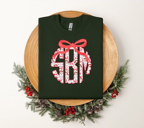 Santa Monogram with a Bow.. YES, please 🎅🏼❤️ 🎄Now available online + the app🎄 🎅🏼include your monogram at checkout 🎅🏼first name, last name, middle name 🎅🏼from the mock photos: Samantha Marie Bartolotti would be “SBM” 🎅🏼youth sizes available upon request 🎅🏼turn around time 10-14 business days Christmas Shirts Vinyl, Christmas Monogram Shirt, Monogram Shirt, Monogram Shirts, Christmas Monogram, Middle Name, First Name, Cricut Projects, First Names