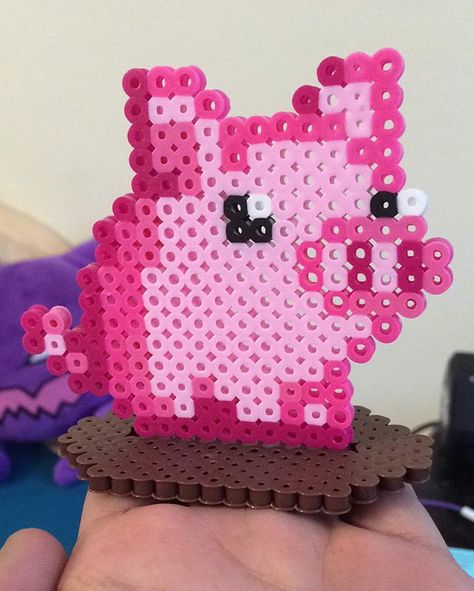 A cute little pig sprite sitting in a mud puddle for a friend. ☺️ #perler #perlerbeads #pig #cute Perler Pattern, Pig Cute, Mud Puddle, Beads Perler, Perler Creations, Pixel Beads, Melty Bead Patterns, Traditional Wreath, Children's Activities