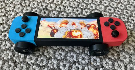 Nintendo switch pinewood derby car Pine Wood Derby Cars Designs Cub Scouts, Awana Grand Prix Car Ideas For Boys, Pokemon Derby Car, Girls Pinewood Derby Cars, Minecraft Pinewood Derby Car, Pine Car Derby Ideas Design, Awana Car Designs, Pine Derby Cars Ideas Design, Cub Scout Derby Car Ideas