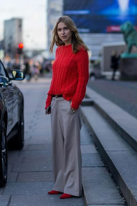 Pernille Teisbaek skips the coat and looks chic for a winter day in wide-leg, slouchy pants and a vivid knit sweater. Click for more fresh winter outfit ideas. Red Sweater Outfit, Grey Pants Outfit, Pernille Teisbaek, Red Outfits, Red Knit Sweater, Copenhagen Fashion, Copenhagen Fashion Week, Grey Outfit, Malene Birger