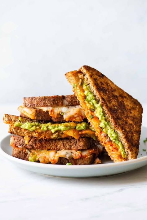 This kimchi and avocado grilled cheese sandwich is a quick and delicious weeknight meal. The richness of the cheddar cheese and mashed avocado balances nicely with the tangy and spicy flavors of kimchi. This is a quick meal that’s ready in 15 minutes! Avocado Grilled Cheese, Sandwich Healthy, Vegetarian Grilling, Monte Cristo Sandwich, Grill Cheese Sandwich Recipes, Cheese Sandwich Recipes, Quick Vegetarian Meals, Grilled Cheese Recipes, Healthy Sandwiches