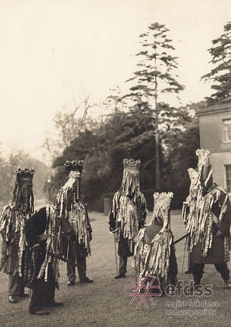 North Waltham Mummers, Hampshire, c. 1949 (Photographer: Douglas Dickins). Mummers’ Plays are a form of traditional drama, usually performed in the streets with a small but varied cast including St. George, the Turk, a doctor, and sometimes Santa Claus. Most mummers’ plays feature a combat scene in which a combatant is wounded or killed and then miraculously revived by the doctor. The costume varies from region to region, but those in Hampshire are known for their “tattered” jackets. Traditional Song, Pagan Rituals, The Turk, New Museum, Folk Dance, Traditional English, Folk Costume, Wonderful World, Weird And Wonderful