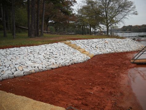 Stone RipRap erosion prevention is one of the fastest and cost effective methods to secure embankments of earth from both wind, water and… Rip Rap Landscaping, Riprap Shoreline, Mountain Island, Jungle Resort, Lake Wylie, Flood Protection, Lake Norman, Lake Cabin, Island Lake