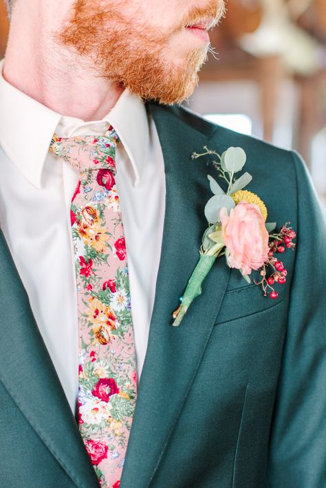 Jack decided to ditch the classic black tie and opt for one that was covered in the flowers that were a part of the rest of their wedding. Follow our social media for more of Katie and Jack's dreamy wildflower wedding! IG: @maurajanesphoto | Website: maurajanephotography.com Colorful Wedding Outfit Men, Groom Floral Shirt, Groom Attire Garden Wedding, Whimsical Groomsmen Attire, Men’s Wedding Looks, Wildflower Wedding Groom Suit, Colorful Wedding Suits Men, Wildflower Wedding Suit, Floral Groom Suit