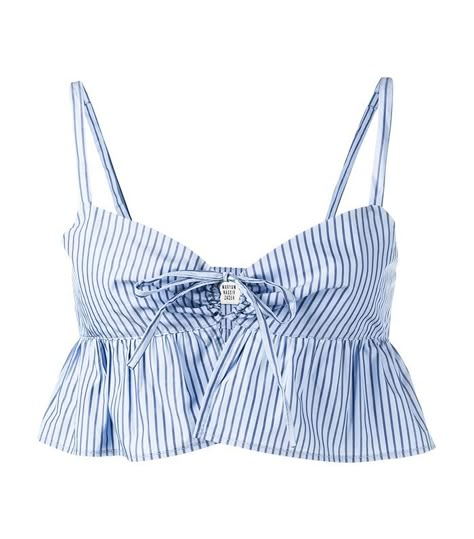 How Every Body Type Can Pull Off a Crop Top via @WhoWhatWear Blue Ruffle Top, Frilly Top, Blue Striped Top, Frill Tops, Blue Crop Top, Blue Striped Shirt, Ruffle Crop Top, Wear Crop Top, Maryam Nassir Zadeh