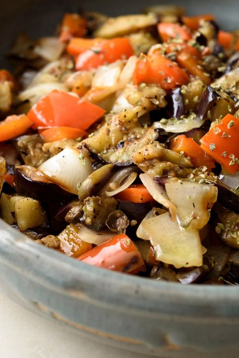 NYT Cooking: The happy mix of eggplant, peppers and onions is found throughout the Mediterranean. Cooking the vegetables over hot coals adds a welcome smokiness, but even a stovetop grill gives a hint of smoky flavor, so don’t fret if you can’t grill outside. This salad is meant to be served at room temperature. Feel free to make it up to 2 hours ahead. Sauteed Eggplant, Grilled Eggplant, Nyt Cooking, Onion Recipes, Eggplant Recipes, Peppers And Onions, Grilled Vegetables, Bell Peppers, Sweet And Spicy