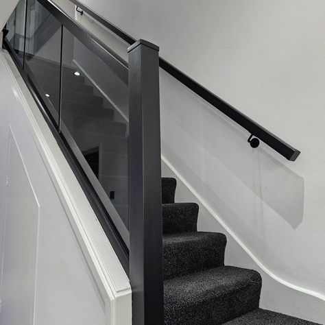 Black Stair Balustrade, Black Staircase With Glass Railing, Black And Glass Banister, Black Railing With Glass Panels, Black Metal Balustrade, Stair Banister Ideas, Black Skirting, Glass Banister, Black Banister