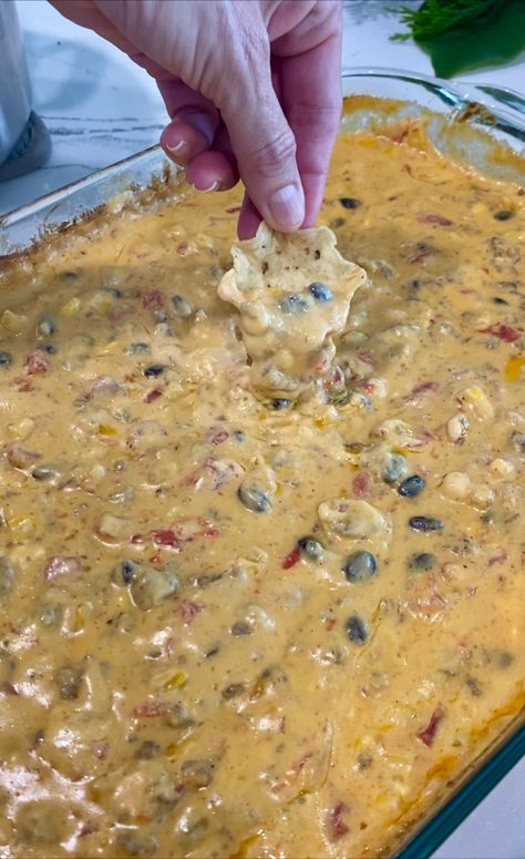 Want to take your appetizer game to the next level? You have to try this Cowboy Queso Dip recipe. A combination of 3 cheeses loaded with sausage, black beans, corn and spices for the ultimate cheesy dip everyone will love.It's almost football season and you know what that means? Tailgate food! When I think of tailgating food I think of hot dogs, burgers and all the dips. This Cowboy Queso Dip is next level delicious! Simply throw everything into a baking dish or slow cooker and heat until ... Loaded Cowboy Cheese Dip, Cowboy Queso Dip, Cowboy Queso, Queso Dip Recipe, Black Beans Corn, Queso Dip Recipes, Cheesy Dip, Football Party Food, Tailgating Recipes