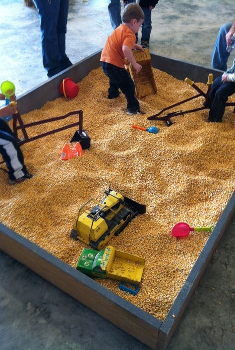 This is such a great idea! Instead of using sand in a sandbox, you can use corn kernels. It's less of a mess and still as much fun for kids. Diy Sandbox, Kids Sandbox, Indoor Play Area, Play Area Backyard, Backyard Kids Play Area, Sand Pit, Kids Outdoor Play, Outdoor Play Area, Backyard Playground