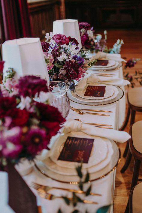 Burgundy, red, purple and pink wedding table decor with floral centrepieces, coloured glassware and gold cutlery | Shot by Bek Burgundy And Purple Wedding Table Settings, Purple Red Wedding Decor, Dark Purple And Pink Wedding Theme, Purple And Burgundy Wedding Decor, Plum Wedding Colors Colour Palettes, Plum And Burgundy Wedding, Red And Purple Wedding Theme, Burgundy And Purple Wedding, Sangria Wedding Colors