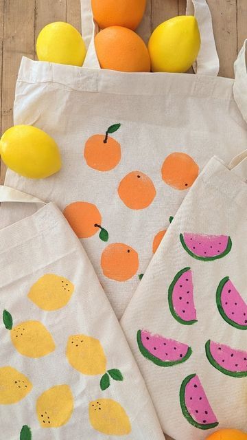 Studio Rosie on Instagram: "Potato Stamp Fruit Tote Bags! 🍉 Rosie and I had a lot of fun making these tote bags! They are going to be party favors for Mae's fruity birthday party 🍉🍋🍊 To make the watermelon print, I cut a potato in quarters and painted the cut side with acrylic paint. We stamped the tote bag and outlined the watermelon slice with green and added black seeds. These were so easy to make and I love how summery the fruit prints are! #invitationtocreate #recycleandplay @recycleandplay #recyclemeplay @recyclemeplay #littlesplayshare #funbudgetplay #kidscraft #summercrafts #savecraftplay #easycrafts #craftcreateandmake #fantasyhasreallynolimits #playinjune #farmersmarket #twottifruitybirthdayparty" Fruit Tote Bag Painting, Summer Party Crafts, Tote Bag Painting Party, Easy Tote Bag Painting Ideas, Painting Tote Bags Ideas, Painting Ideas On Tote Bags, Diy Painted Tote Bag, Tote Bag Art Painting, Tote Bag Painting Ideas Easy