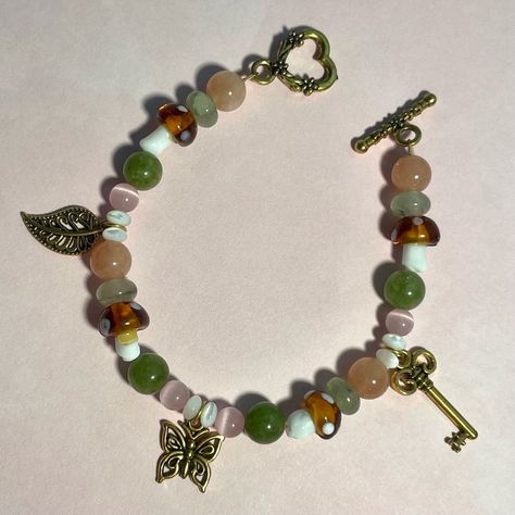 Lavender Land Jewelry | Butterfly Forest bracelet 🔑🍄🤎 7 and a half inches in length Available now on our website! - - - #jewelry #butterflyjewelry #bracelet #s… | Instagram Fairycore Jewelry Aesthetic, Whimsical Beaded Bracelets, Fairycore Bracelets, Fairycore Bracelet, Cottagecore Bracelet, Forest Outfits, Bog Witch, Butterfly Forest, Fairy Bracelets