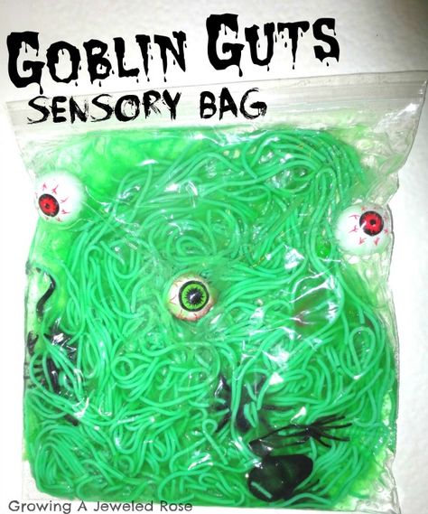 Goblin Sensory Bag: zip-lock bag cooked pasta green food coloring eye balls, spiders, snakes (anything you think will make good goblin guts) Clear hair gel clear packaging tape October Infant Sensory, Infant Halloween Sensory Ideas, Sensory Halloween Activities, Halloween Sensory Bags, Halloween Activities For Babies, Halloween Sensory Activities, Hair Color For Green Eyes, Pasta Green, Sensory Activities For Kids