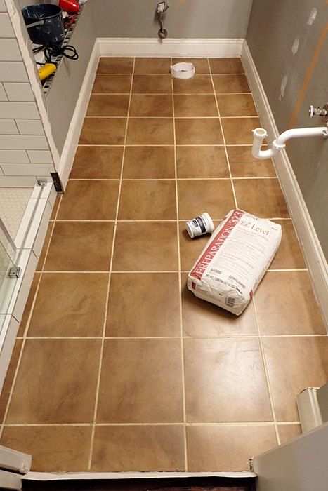 Looking to learn, experiment, and erase a tile floor quick, self-leveling concrete and brass inlays were the weapons of choice. So I finally finished redoing the master shower, right, so ugh, the floor was that much more noticeably awkward and unattractive. It had to go! And go now! But I was so tired of tiling....hm. What to do?I'll try some self-leveling concrete underlayment! Before I get too far into this, I should say that yes, I am aware this product is underlayment and n Concrete Tile Bathroom, Diy Concrete Tiles, Bathroom Concrete Floor, Tile Over Tile, Concrete Floors Diy, Cement Bathroom Floor, Cement Bathroom, Concrete Shower, Tile Floor Diy