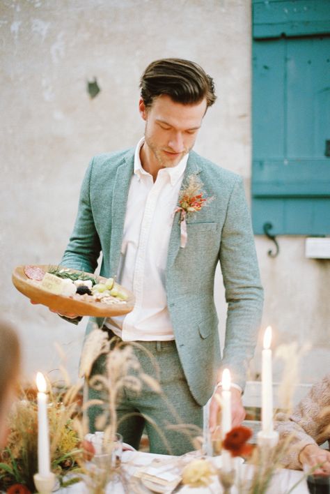 This runaway elopement with southern accents and an artisan feast is too much to handle! Alternative engagement rings, daring color combos and a silky apricot gown are just a few of the eye-popping details you can expect to see in this autumn inspiration on #ruffledblog! Sage Suit Men Wedding, Sage Suit Groom, Groom Suit Italian Wedding, Colored Suit Groom, Cool Wedding Suits For Men, Groom Suit Alternative, Summer Groom Suit Ideas, Groom Alternative Outfit, Wedding Suit Inspiration