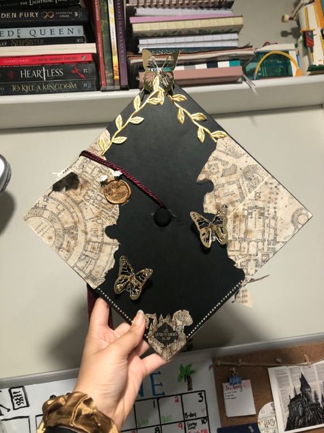 Museum Graduation Cap, Noah Kahan Grad Cap Ideas, Graduation Cap Designs Book Theme, Grad Cap Music Ideas, Hunger Games Grad Cap, Senior Hats Decoration, Interior Design Grad Cap, Graduation Cap Designs Travel, Flat Graduation Cap Decoration