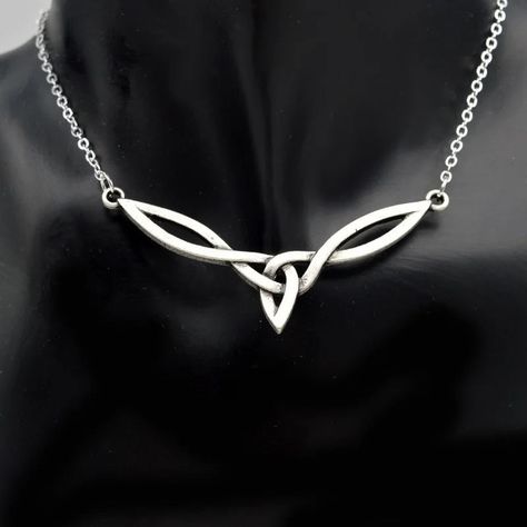 Viking Irish Celtic Knot Pendant Necklace, Celtic Jewelry, Silver Magic Wicca Viking Necklace👇 Celtic Jewelry, Silver Magic Wicca Viking Necklace This Viking Irish Celtic Knot Pendant Necklace is a statement piece of simple fashion jewelry in silver color. The design features a heart-shaped pendant with a water-wave chain, made of durable zinc alloy material. Perfect for men who appreciate Viking and Irish cultures. https://postdolphin.com/t/LO0VJ Simple Celtic Knot, Triquetra Necklace, Celtic Knot Necklace, Celtic Knot Pendant, Art Necklaces, Viking Necklace, Irish Jewelry, Gold Chains For Men, Necklace For Girlfriend