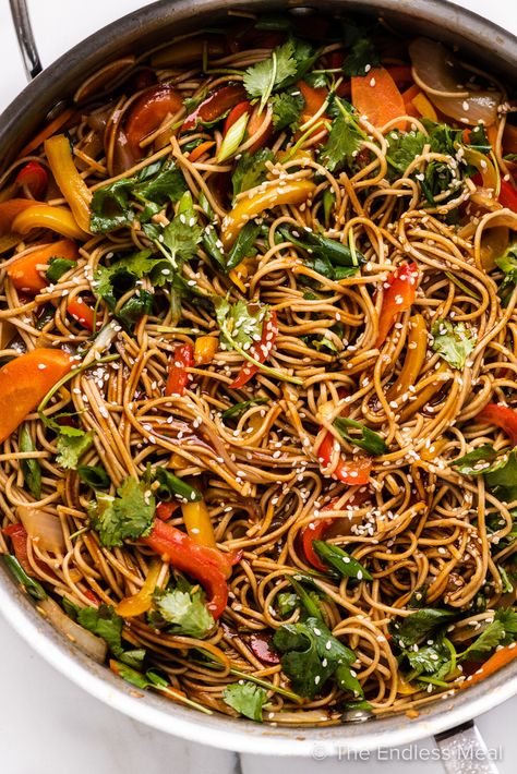 Here's a 20-minute recipe for soy ginger noodles that's delicious, healthy, and quick. It's chewy soba noodles lightly sautéed with tons of fresh vegetables in a savory-sweet soy ginger sauce. Keep it vegetarian or top it with your favorite protein (chicken, beef, pork, shrimp, tofu, etc.) for a complete meal. It's a better-than-take-out dish that can be served warm or cold, and leftovers make a tasty lunch! #theendlessmeal #soygingernoodles #noodles #pasta #takeout #vegetarian #stirfry Tofu Soba Noodles, Spicy Soba Noodles, Easy Noodle Recipes, Family Meals Kids, Ginger Noodles, Shrimp Tofu, Soy Ginger Sauce, Soba Noodles Recipe, Vegetarian Noodles