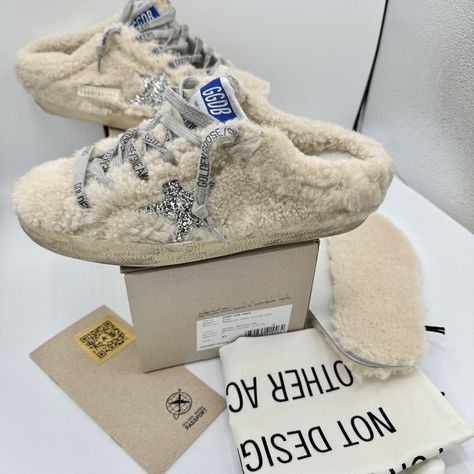 Brand New. Never Worn. No Flaws. Authentic Golden Goose Super Star Sabot Sneakers / Slip On Mule Shearling * Real Fur * Upper In Natural. Glitter Star In Silver. White / Gold Brand Logo On Side. Blue / White Brand Logo On Tongue. Grey Laces With Brand Name As Well. Size Eu 37 Fits Usa Women’s 6.5 To 7. Includes Original Box. Original Dust Bag. All Original Items. Authenticity Passport / Pamphlet. Includes Both Smooth Leather Perforated Soles And Shearling Soles. Intentionally Distressed Design. Golden Goose Superstar, Usa Women, Slip On Mules, Glitter Stars, Swag Shoes, Super Star, Gold Branding, White Brand, Real Fur