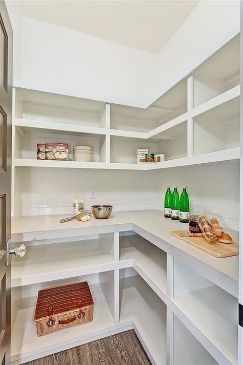 Fabulous walk-in pantry with L-shaped, built-in shelving and a wraparound counter finished with a subway tile backsplash. L Shaped Pantry, Kitchen Corner Cupboard, Kitchen Cabinet Organization Layout, Pantry Layout, Diy Cupboards, Diy Pantry Organization, Pantry Remodel, Best Kitchen Cabinets, Pantry Shelving