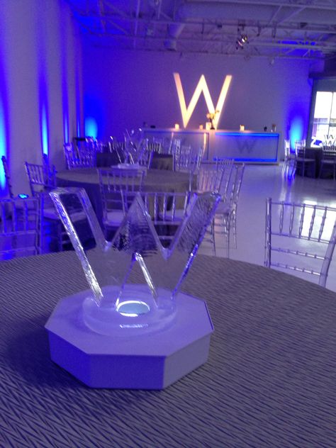 RS Event Productions in Dallas designed a W theme for a bar mitzvah. Ice centerpieces of the logo. Logo Centerpieces, Ice Centerpieces, Corporate Party Ideas, Corporate Event Centerpieces, Led Centerpieces, Table Coordinate, Launching Event, Bat Mitzvah Themes, Gala Decorations