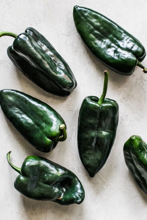 Learn how to make roasted poblano peppers in an oven or over an open flame for use in many delicious recipes! Ready in 15 minutes or less! #poblanos #roastedpoblanos #mexicanrecipes Rellenos Recipe, Ground Beef Breakfast, Poblano Peppers Recipes, Roasted Poblano Peppers, Ancho Chili Powder, Chile Poblano, Ancho Chili, Poblano Peppers, Mexican Cooking