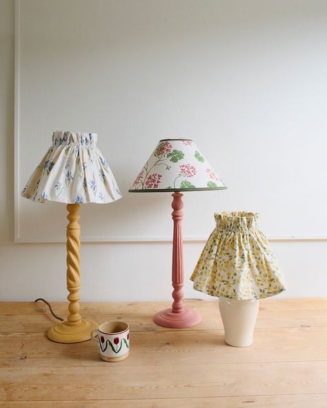 Sophie Harpleys beautiful lampshades 💕  A delightful gathered 'skirt' lampshade cheers up any corner and this lovely calico fabric is just perfect for creating a soft diffused glow. Designed to make a particularly excellent bedside light.  Follow the link to shop the full collection! Designer Painting, Painting Lamp Shades, Bedside Light, Antique Beds, Calico Fabric, Home Garden Design, Table Lamp Base, Bedside Lighting, Living Room Shop