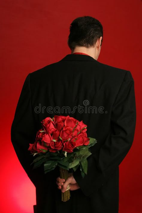 Man holding roses behind his back. Man holding out large bouquet of red roses be , #AFFILIATE, #roses, #holding, #Man, #large, #backdrop #ad Holding Roses Pose, Men With Roses, Man Holding Bouquet, Man With Roses In Hand, Man Holding Flowers Pose Reference, Man Giving Flowers, Man With Flowers In Hand, Man Giving Flowers To Woman, Guy Holding Flowers