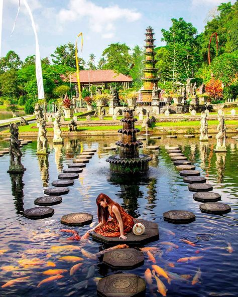 Travel & Lifestyle I Singapore on Instagram: “Discover Bali l Tirta Gangga Water Palace⁣ ⁣ At the Tirta Gangga royal water garden feeding these royal fishes. ⁣ ⁣ These royal fishes are…” Tirta Gangga Bali, Bali Couple, Tirta Gangga, Bali Summer, Fish Pose, Best Instagram Photos, Pose Fotografi, Summer 24, Couple Poses