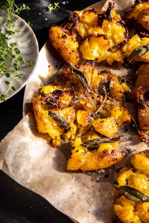 Crispy Brown Butter Sage Smashed Potatoes: With hints of sage, thyme, parmesan, and garlic, these easy-to-make potatoes are sure to be a hit! Bourbon Sweet Potatoes, Brown Butter Sage, Half Baked Harvest Recipes, Butter Potatoes, Autumn Side Dishes, Sage Butter, Cheesy Mashed Potatoes, Harvest Recipes, Half Baked