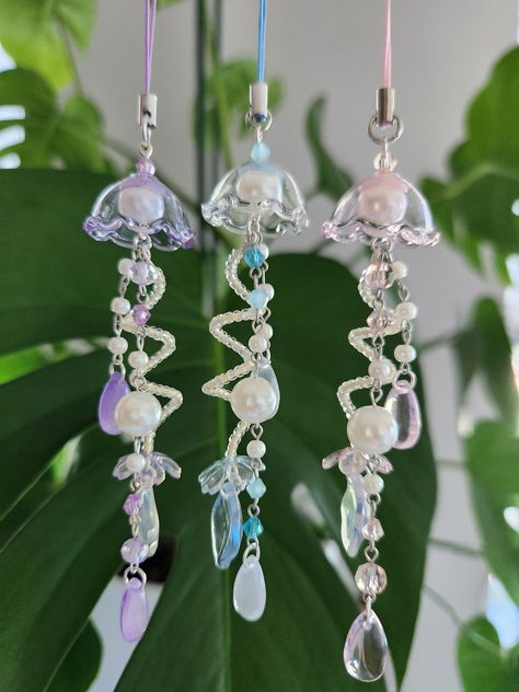 beautiful handmade pearl jellyfish phone charm in a cute coquette style also available as a keychain Pearl Phone Charm, Kawaii Coquette, Keychain Pink, Diy Jewelry Earrings, Mermaid Aesthetic, Beaded Jewlery, Diy Bracelet Designs, Cute Keychain, Fun Diy Crafts